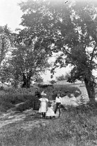 Crawford children walking outside, c1896